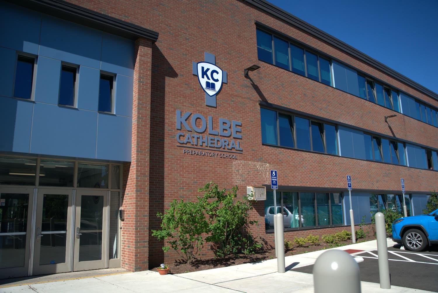 The Kolbe Cathedral Preparatory School building and crest