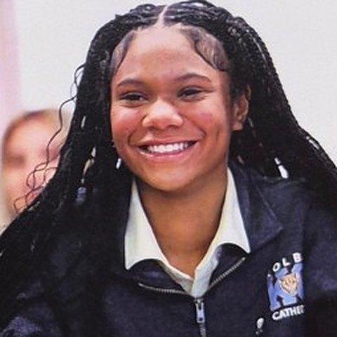A Kolbe student in uniform, smiling